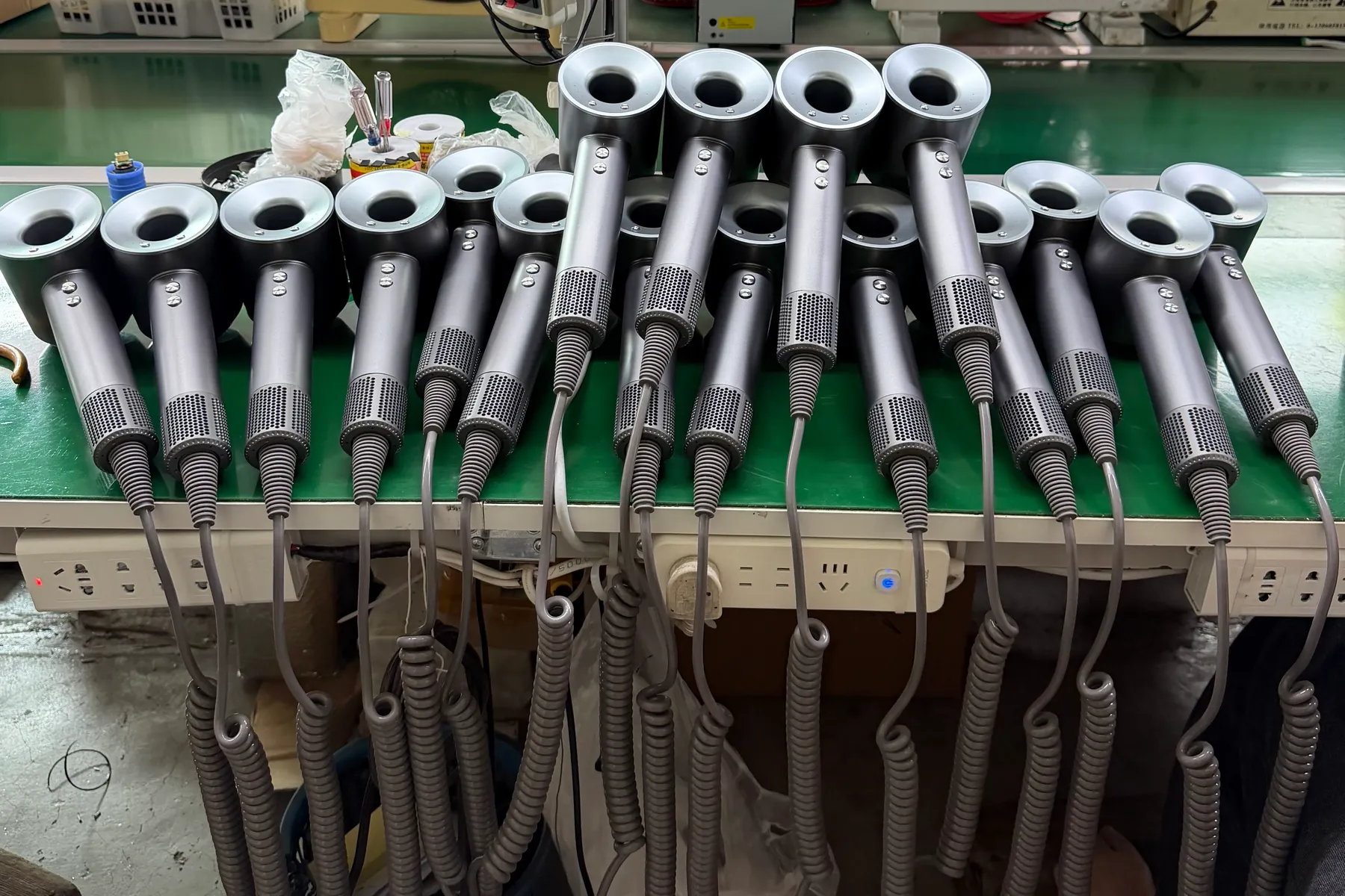 Custom-color hotel hair dryers arranged for bulk production inspection and assembly