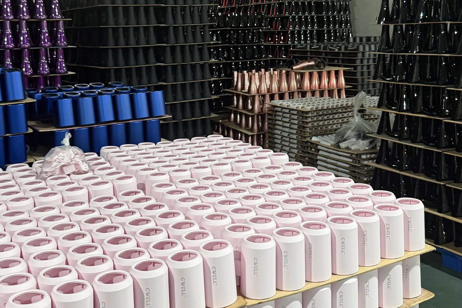 Custom-color hair dryer housings in pink, blue, black, purple and metallic finishes after spray painting