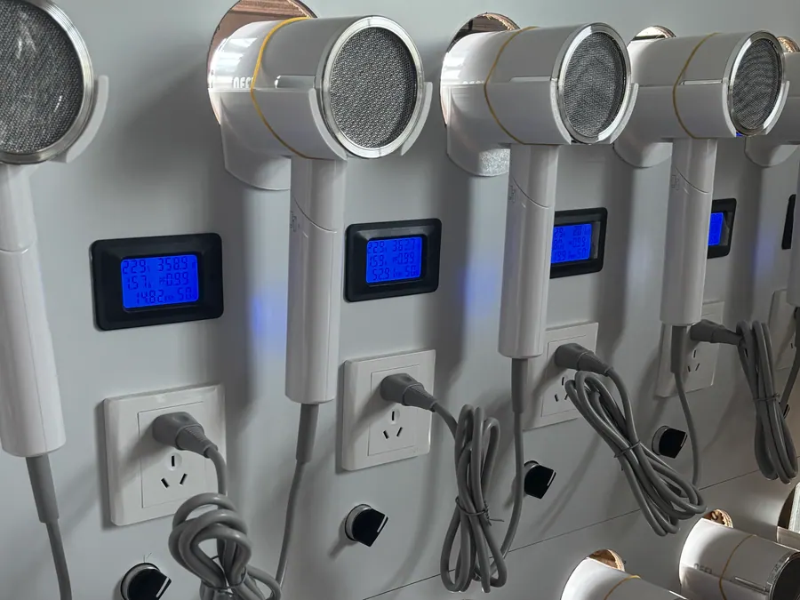 Hotel hair dryers undergoing factory aging and power testing