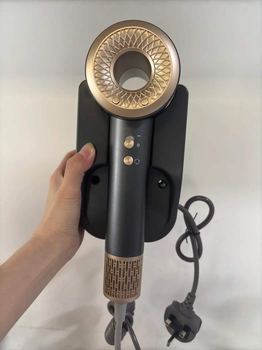 Actual grey H21 hair dryer sample with Type G holder, coiled security cord and UK-style plug