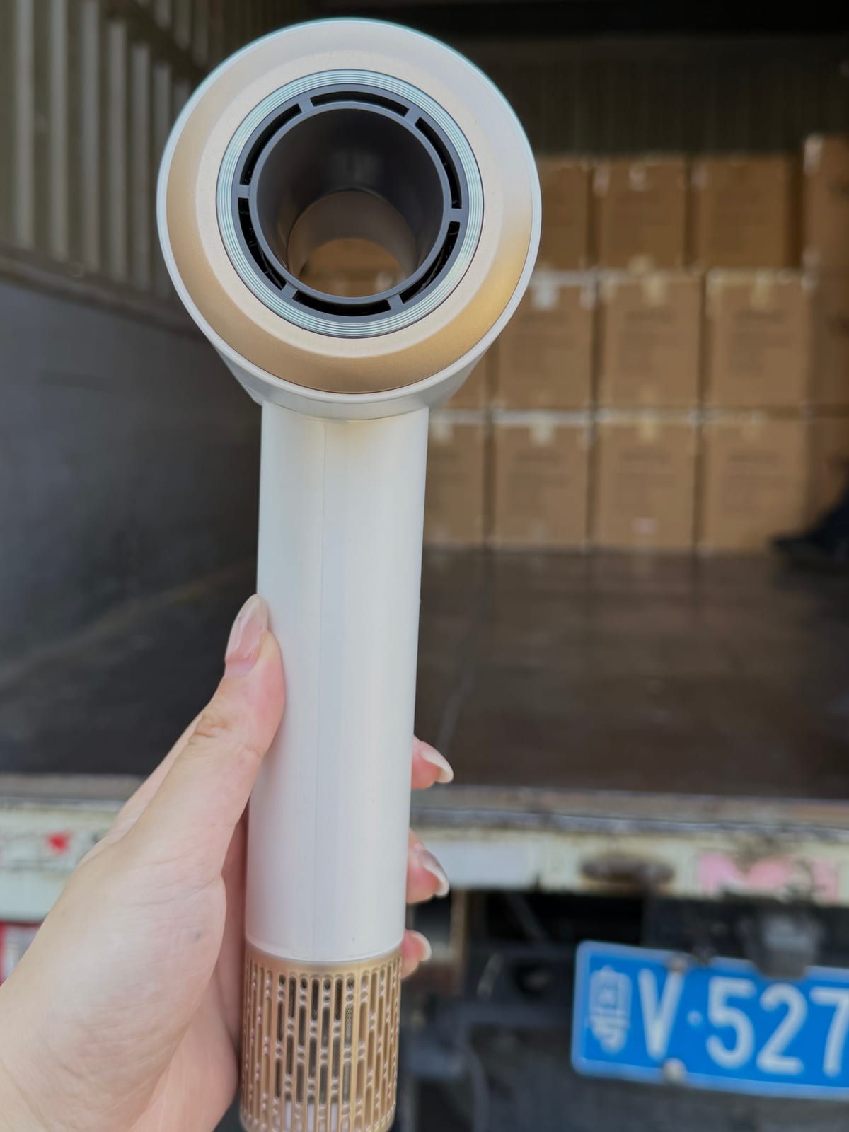 Close-up of the White H21 high-speed hotel hair dryer sculpted air outlet and gold accents
