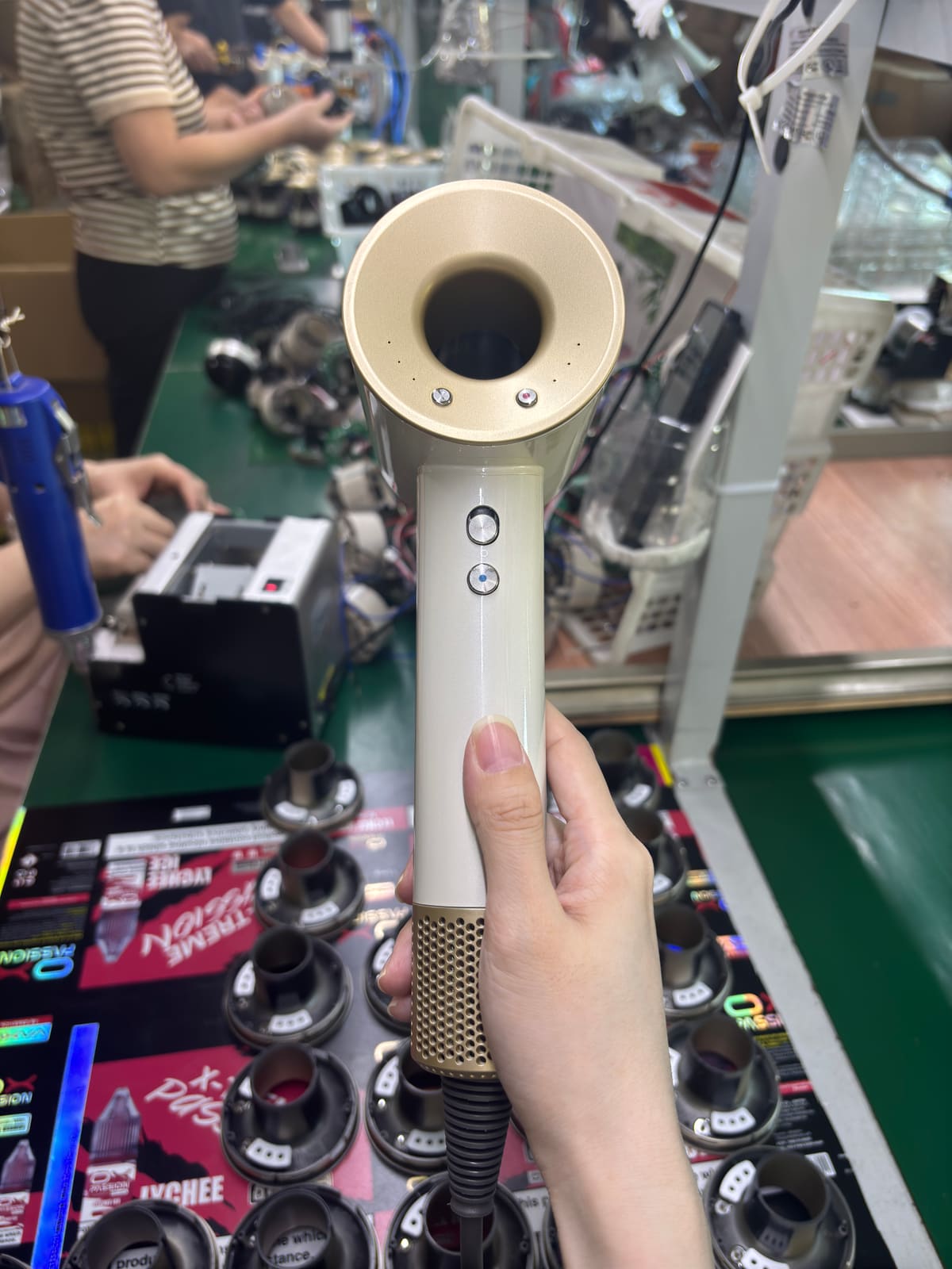 White H21 high-speed hotel hair dryer control buttons during assembly inspection