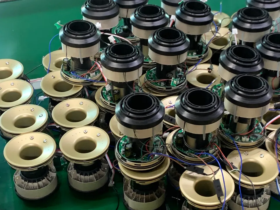 Hair dryer body assemblies with exposed circuit boards and wiring during production